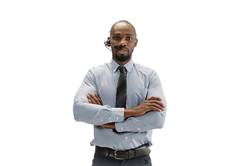 Image showing Young african-american call center consultant with headset isolated on white studio background