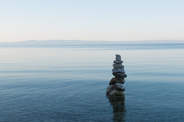 Image showing Balance stone pyramid on the sea coast