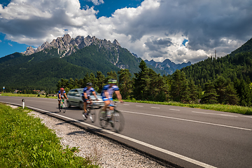 Image showing Cyclists riding a bicycle on the road in the background the Dolo