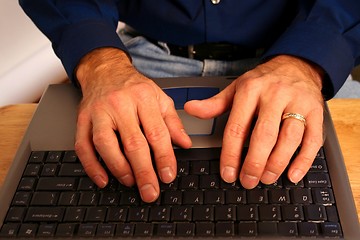 Image showing Male Hands Working on Laptop