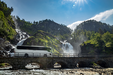 Image showing Tourist bus traveling on the road Latefossen Waterfall Odda Norw