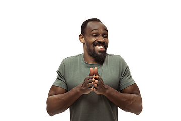 Image showing Young african-american man with funny, unusual popular emotions and gestures isolated on white studio background