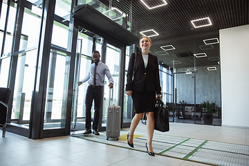 Image showing Meeting of young business partners after arriving to end point of business trip