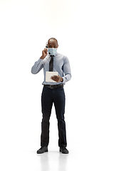 Image showing Young african-american call center consultant with headset isolated on white studio background