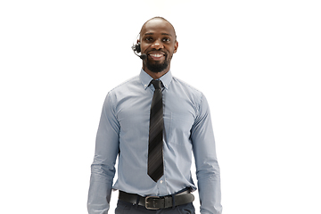 Image showing Young african-american call center consultant with headset isolated on white studio background
