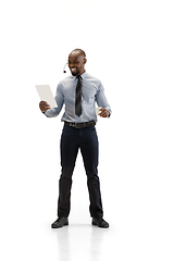 Image showing Young african-american call center consultant with headset isolated on white studio background