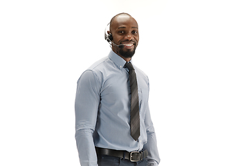 Image showing Young african-american call center consultant with headset isolated on white studio background