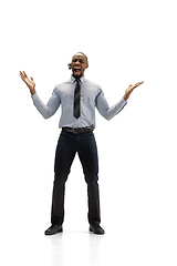 Image showing Young african-american call center consultant with headset isolated on white studio background