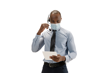 Image showing Young african-american call center consultant with headset isolated on white studio background