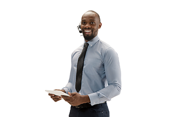 Image showing Young african-american call center consultant with headset isolated on white studio background