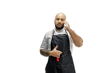 Image showing Portrait of a male chef cook, butcher isolated on a white studio background