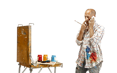 Image showing Artist, painter at work isolated on white studio background