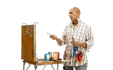 Image showing Artist, painter at work isolated on white studio background