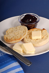 Image showing English muffin with butter and jam
