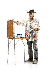 Image showing Artist, painter at work isolated on white studio background