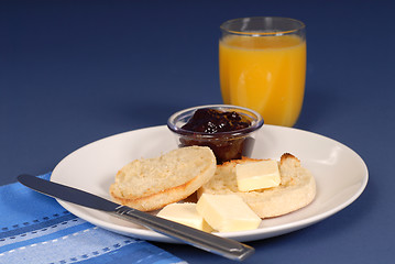 Image showing English muffin butter, jam, juice