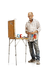 Image showing Artist, painter at work isolated on white studio background