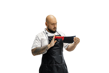 Image showing Portrait of a male chef cook, butcher isolated on a white studio background