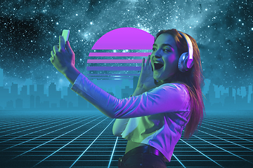 Image showing Synth wave and retro wave, vaporwave futuristic aesthetics. Woman with device in glowing neon style.