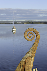 Image showing A modern sailboat and a vikingskip