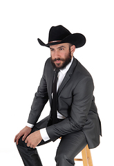 Image showing A portrait image of a man in a suit and cowboy hat