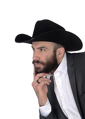 Image showing Close-up portrait of man in a suit and cowboy hat