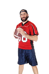 Image showing Young football player standing with his football in his hand