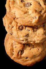 Image showing Closeup of three chocolate chip cookies verticle view