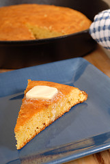 Image showing Slice of cornbread with melting butter