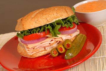 Image showing Turkey and cheese sandwich with dipping sauce