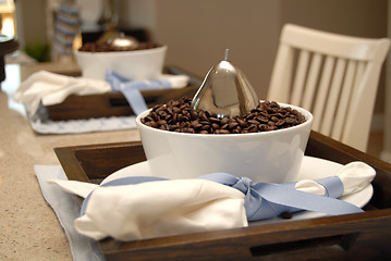 Image showing Two dining place settings with coffee beans on a marble counter