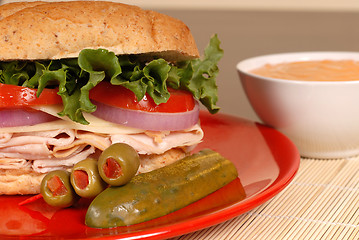 Image showing Turkey and swiss cheese sandwich with red pepper dipping sauce