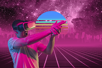 Image showing Synth wave and retro wave, vaporwave futuristic aesthetics. Man with device in glowing neon style.