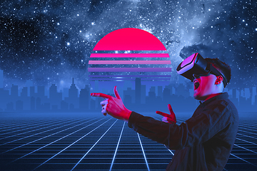 Image showing Synth wave and retro wave, vaporwave futuristic aesthetics. Man with device in glowing neon style.