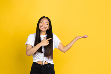 Image showing Smiling girl with surreal huge smile and big mouth looks shocked, attracted, wondered and astonished. Copyspace for ad.