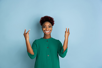 Image showing Smiling girl with surreal huge smile and big mouth looks shocked, attracted, wondered and astonished. Copyspace for ad.