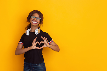 Image showing Smiling girl with surreal huge smile and big mouth looks shocked, attracted, wondered and astonished. Copyspace for ad.