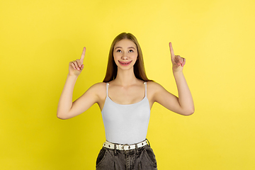 Image showing Smiling girl with surreal huge smile and big mouth looks shocked, attracted, wondered and astonished. Copyspace for ad.