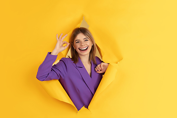 Image showing Smiling girl with surreal huge smile and big mouth looks shocked, attracted, wondered and astonished. Copyspace for ad.