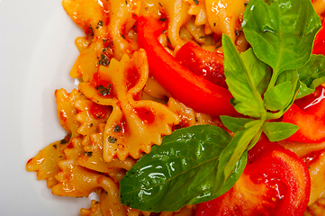 Image showing Italian pasta farfalle butterfly bow-tie and tomato sauce