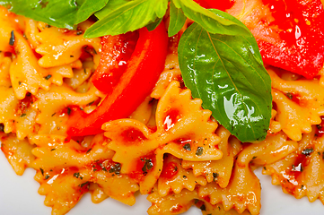 Image showing Italian pasta farfalle butterfly bow-tie and tomato sauce