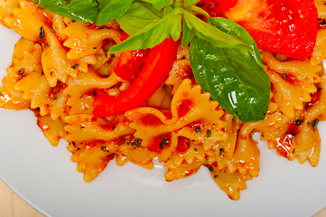 Image showing Italian pasta farfalle butterfly bow-tie and tomato sauce