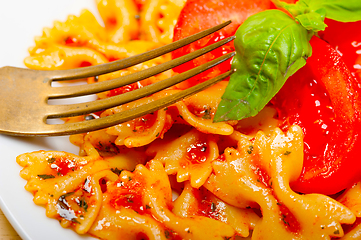 Image showing Italian pasta farfalle butterfly bow-tie and tomato sauce