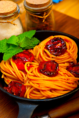 Image showing italian spaghetti pasta and tomato with mint leaves