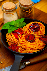 Image showing italian spaghetti pasta and tomato with mint leaves