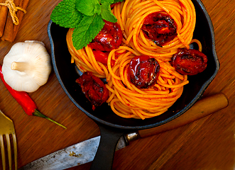 Image showing italian spaghetti pasta and tomato with mint leaves