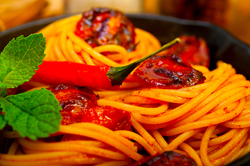 Image showing italian spaghetti pasta and tomato with mint leaves