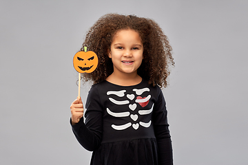 Image showing girl in halloween costume with jack-o-lantern