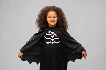 Image showing girl in costume of dracula with cape on halloween