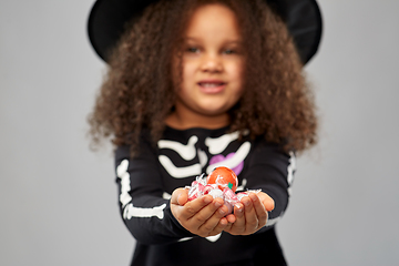 Image showing girl with candies trick-or-treating on halloween